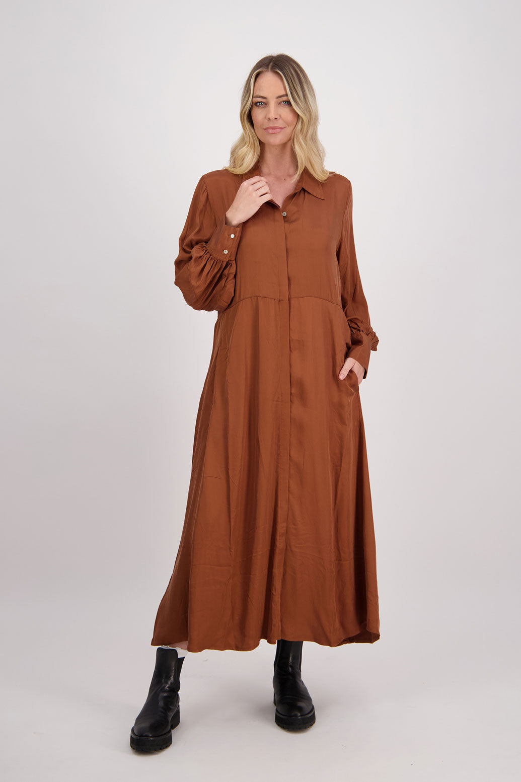 Tan Shirt Dress, maxi length, long sleeves. Fitted through the body draping to A Line skirt. Hidden button front with extended cuffs. Hollie