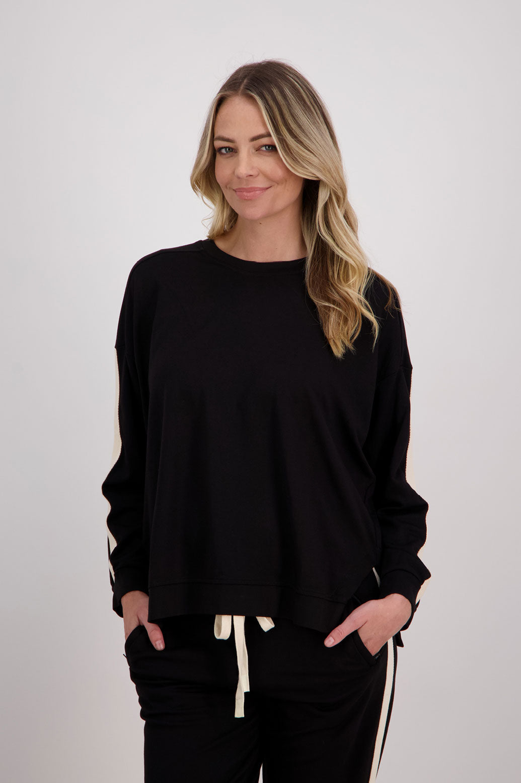 Black Ponte Sweatshirt with white/ivory contrasts side stripe down arms/sleeves. Holmes