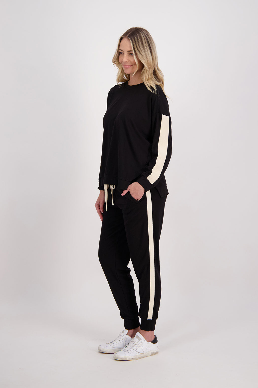 Black Ponte Sweatshirt with white/ivory contrasts side stripe down arms/sleeves. Holmes