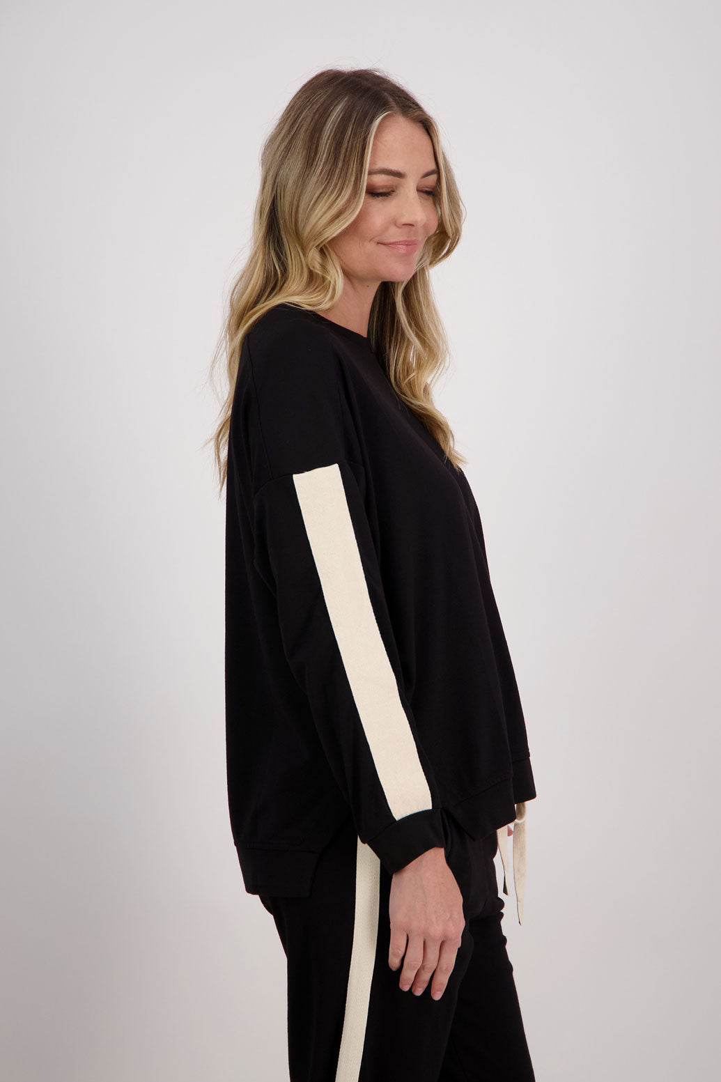 Black Ponte Sweatshirt with white/ivory contrasts side stripe down arms/sleeves. Holmes