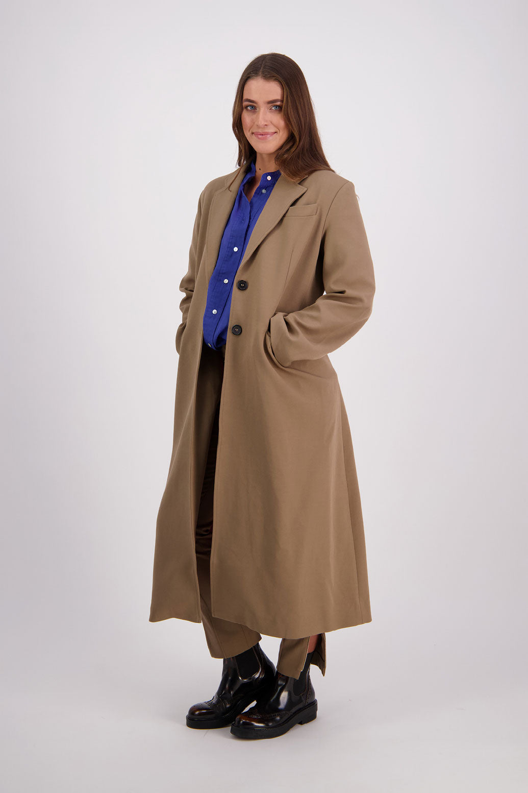 Briarwood Ramie Shirt with stand up collar, panel puffed sleeves and slim fit. Harlow Bright Blue. Paired with Hannah Coat and Helena Pant in Camel