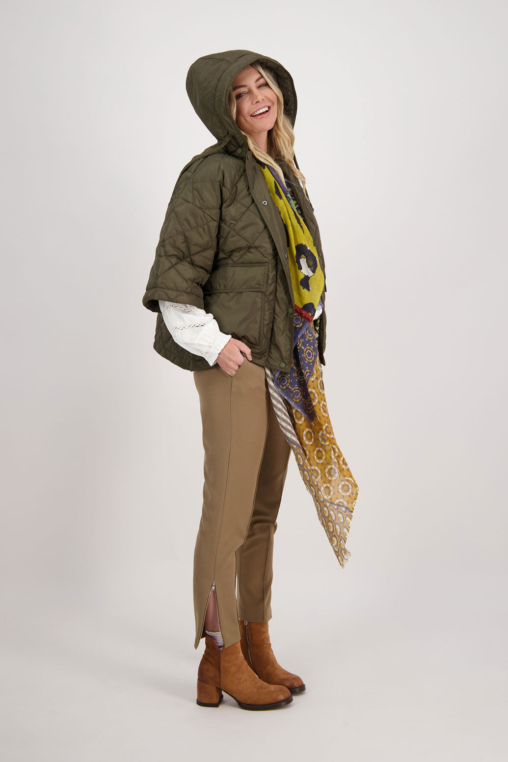 Camel tailored pant with side splits and zips. Front pin stitch detail. Helena. Worn with quilted khaki jacket, Chap