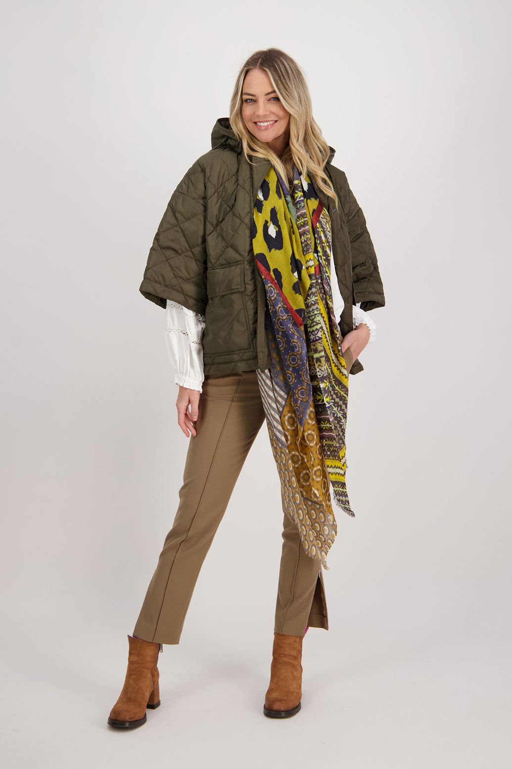 Camel tailored pant with side splits and zips. Front pin stitch detail. Helena. Worn with quilted khaki jacket, Chap