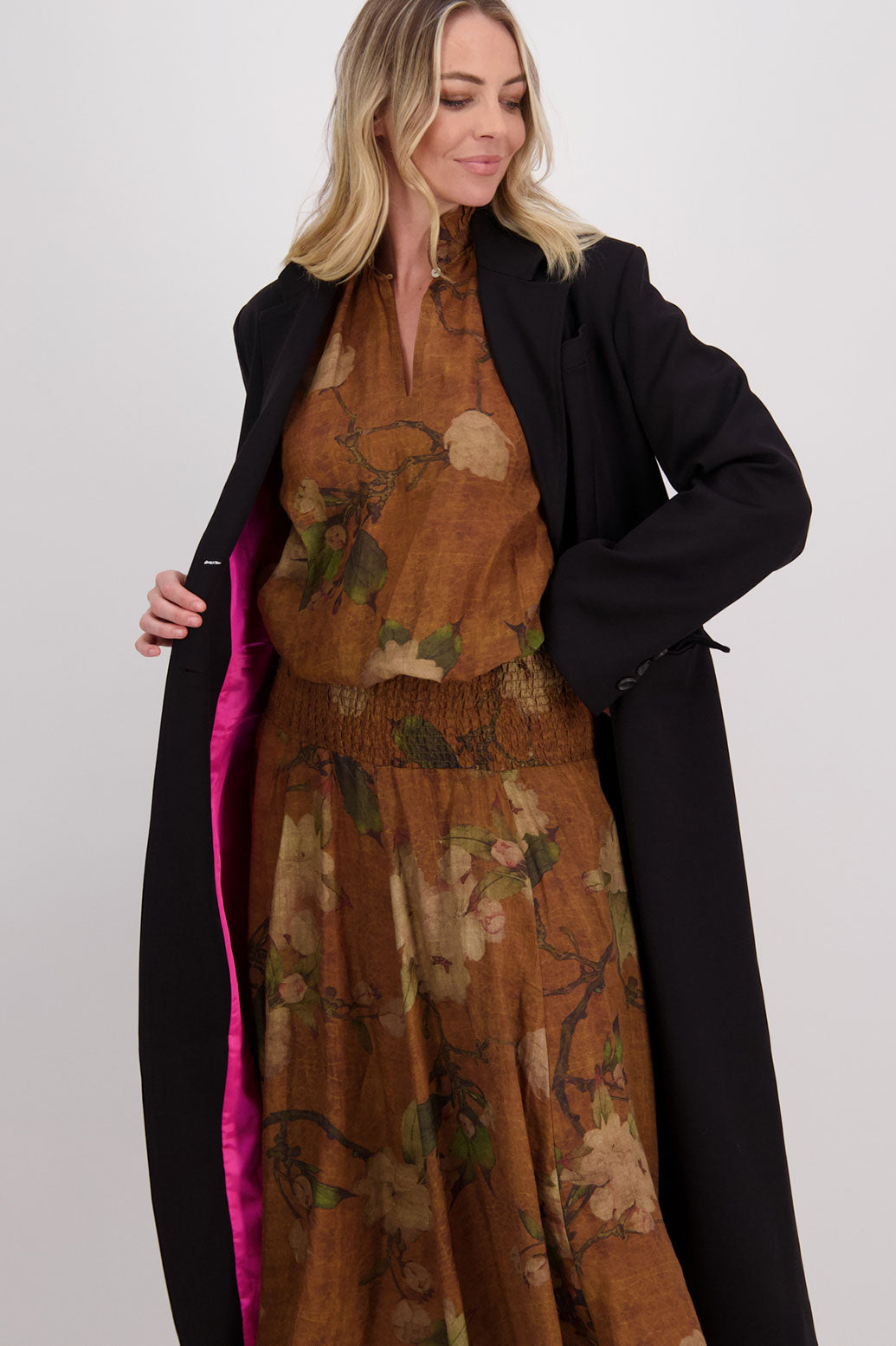 Tan Floral Shirred Waist Ramie Maxi Skirt, Hazelle. Worn with Long Sleeve Ramie Tan Floral Top, Harper and Hannah Black Coat with Fuchsia lining