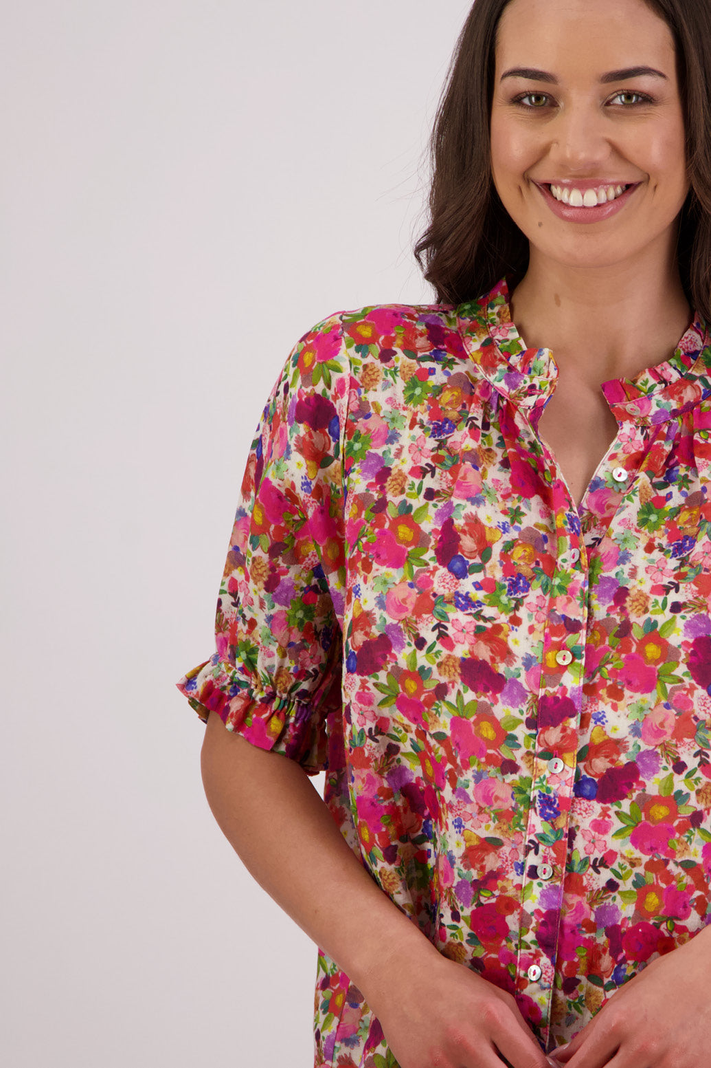 Close up of front view of Briarwood Pearly Shirt in Bright Floral print.