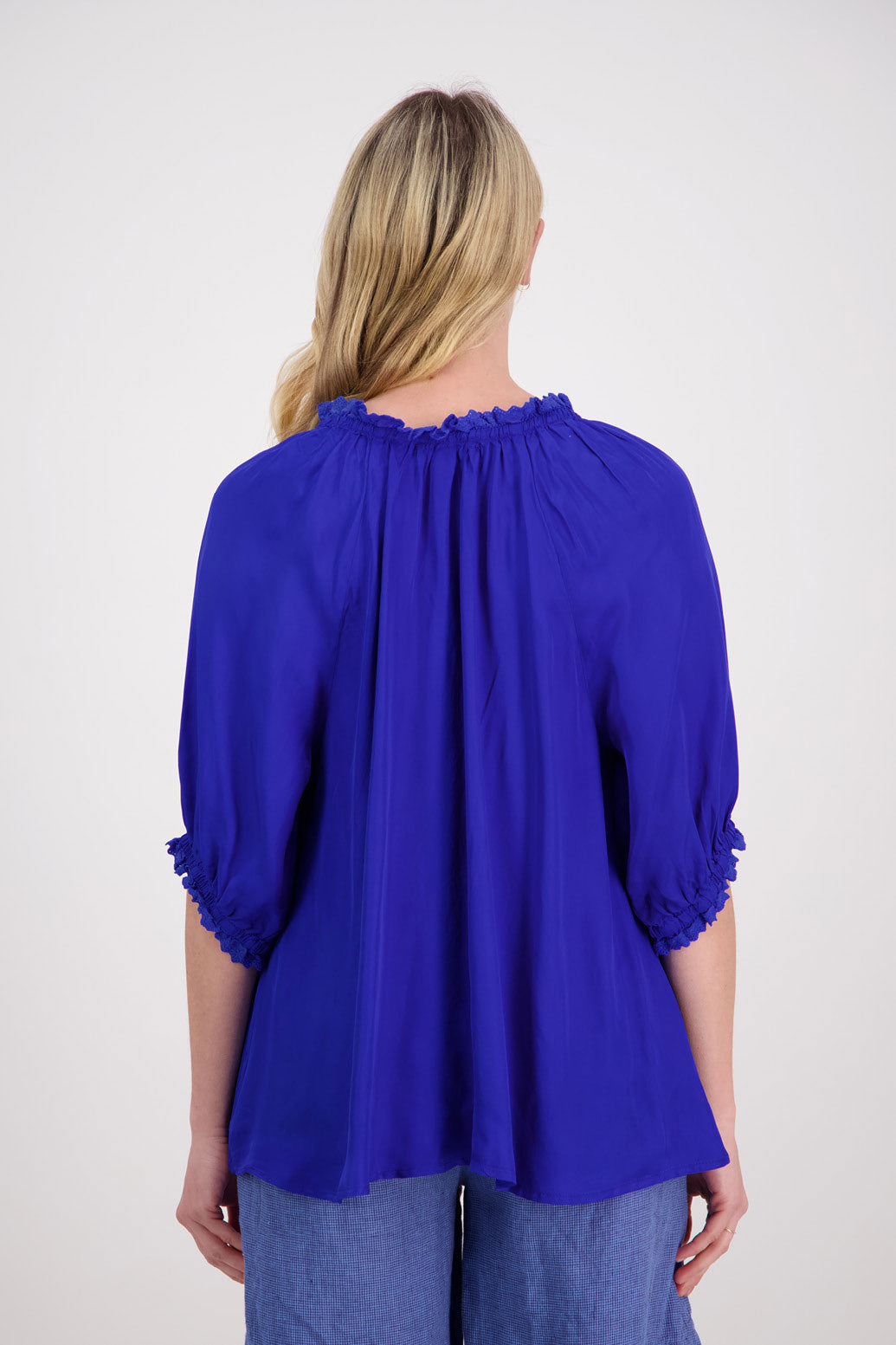 Pebbles Womens Bright Blue Viscose Top with longer short sleeves and V neck with tie. Ruffle around the neck and sleeves. Slightly longer at the back.