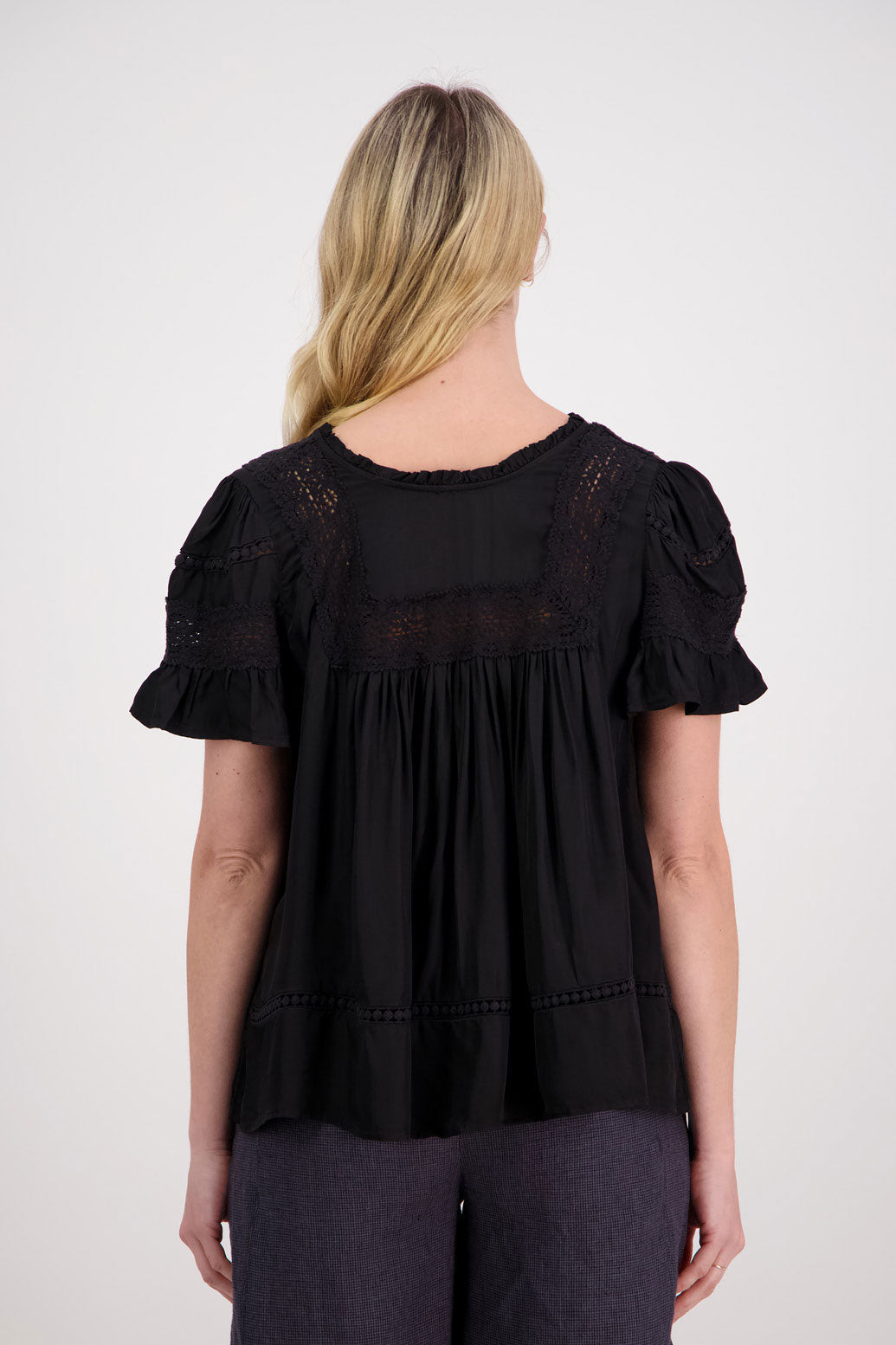 Perkins Womens Reversible Top. Wear as a V neck front or turn it around and close the single button at the back. Black