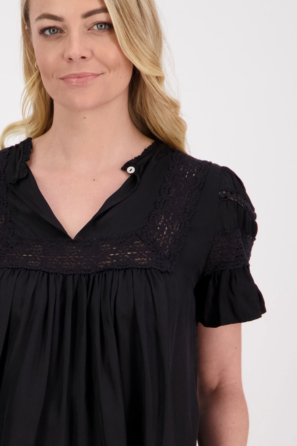 Perkins Womens Reversible Top. Wear as a V neck front or turn it around and close the single button at the back. Black