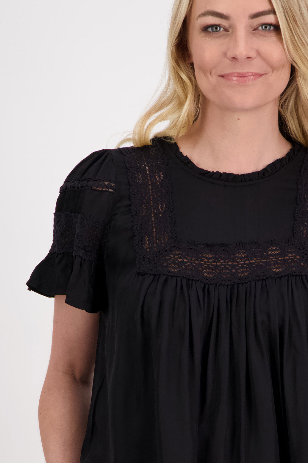 Perkins Womens Reversible Top. Wear as a V neck front or turn it around and close the single button at the back. Black