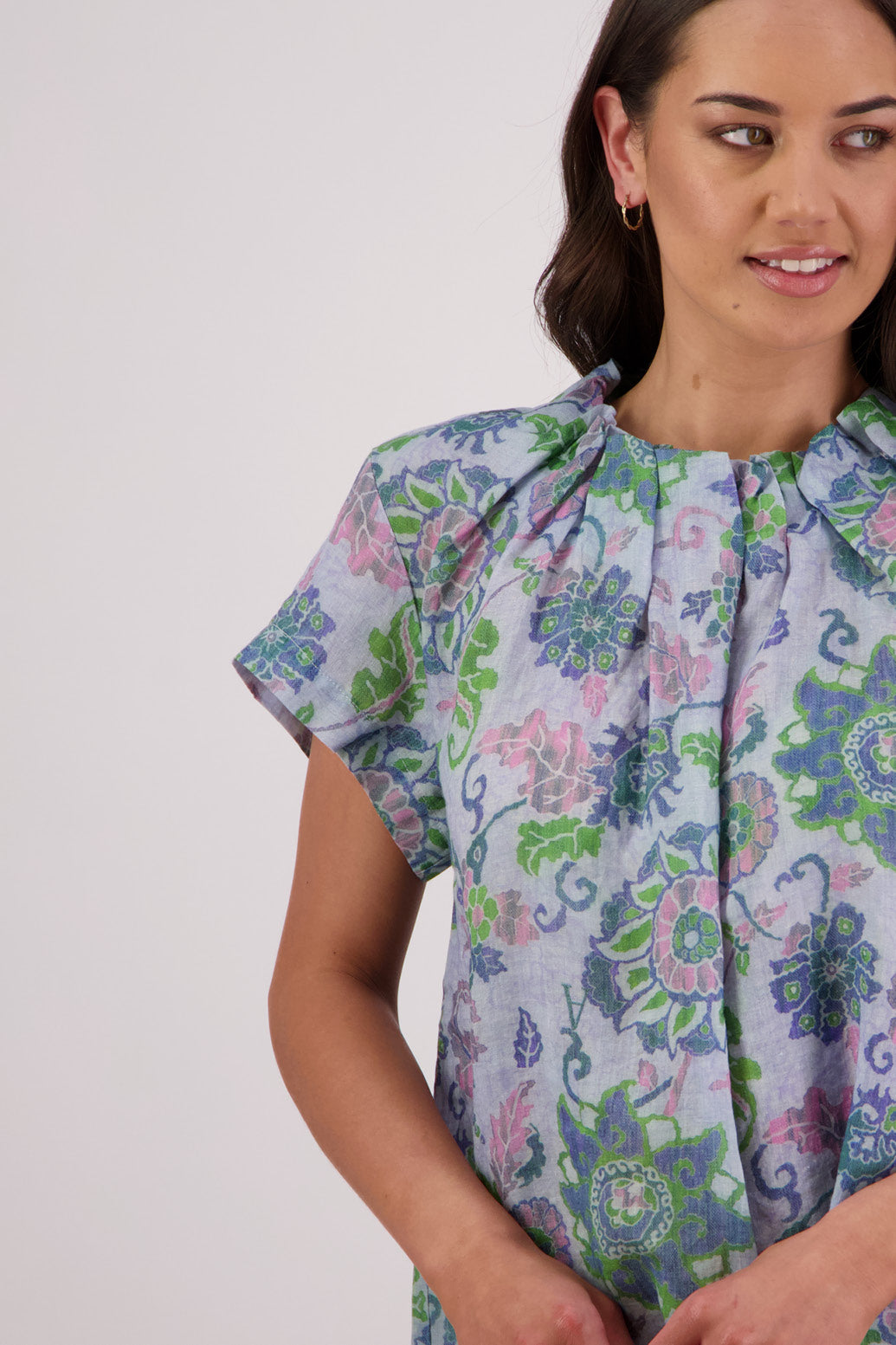 Close up of front view of Briarwood Pia Top in Blue Floral print.