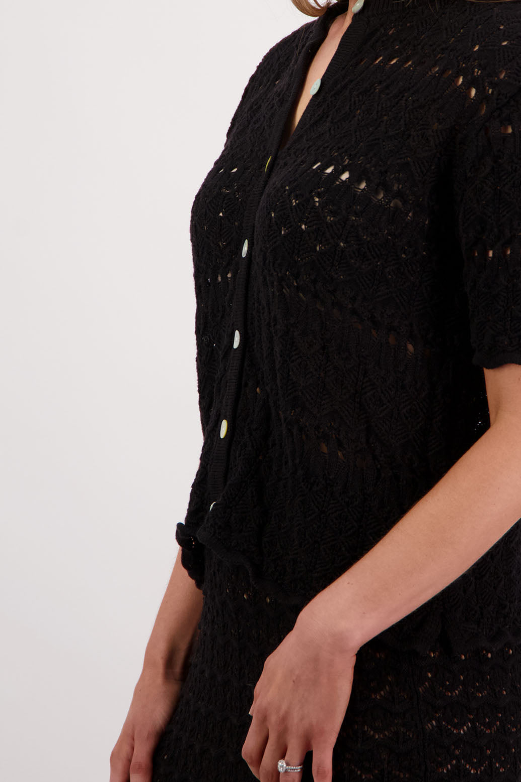 Womens knitted cotton lace short sleeve cardigan with shaped hem and scalloped edging. Briarwood NZ. Posy, Black