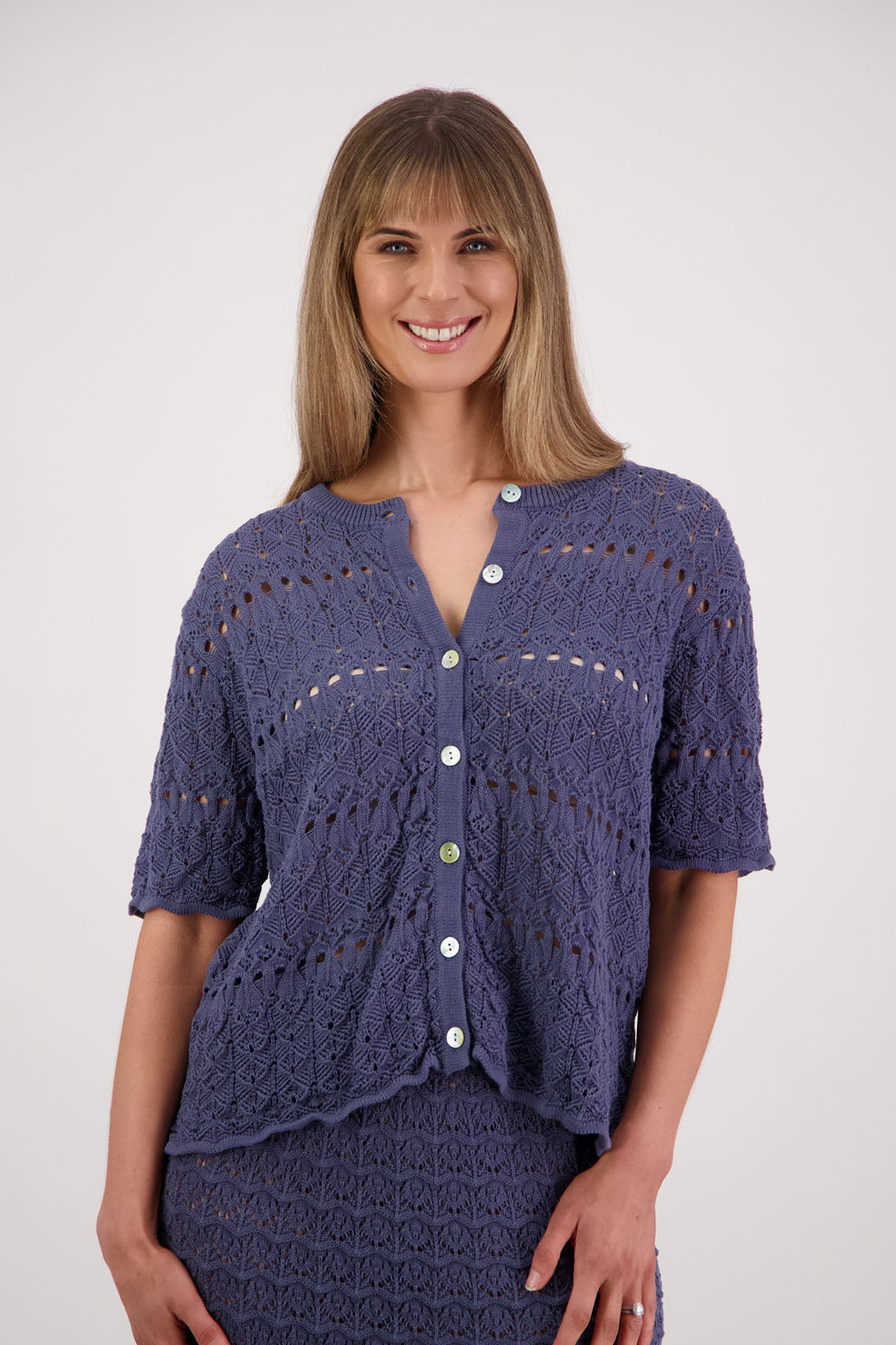 Womens knitted cotton lace short sleeve cardigan with shaped hem and scalloped edging. Briarwood NZ. Posy, Denim Blue