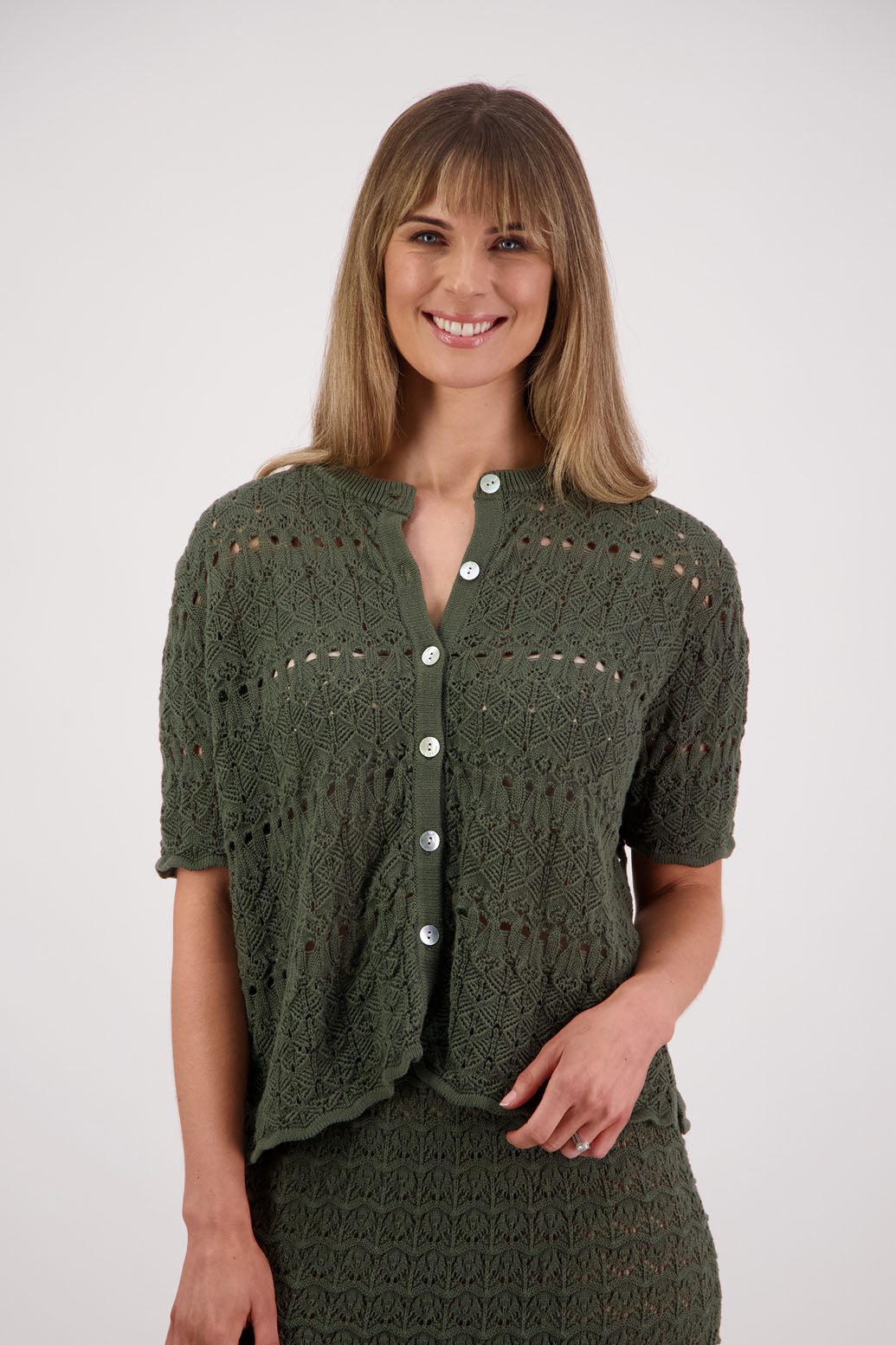 Womens knitted cotton lace short sleeve cardigan with shaped hem and scalloped edging. Briarwood NZ. Posy, Moss Green