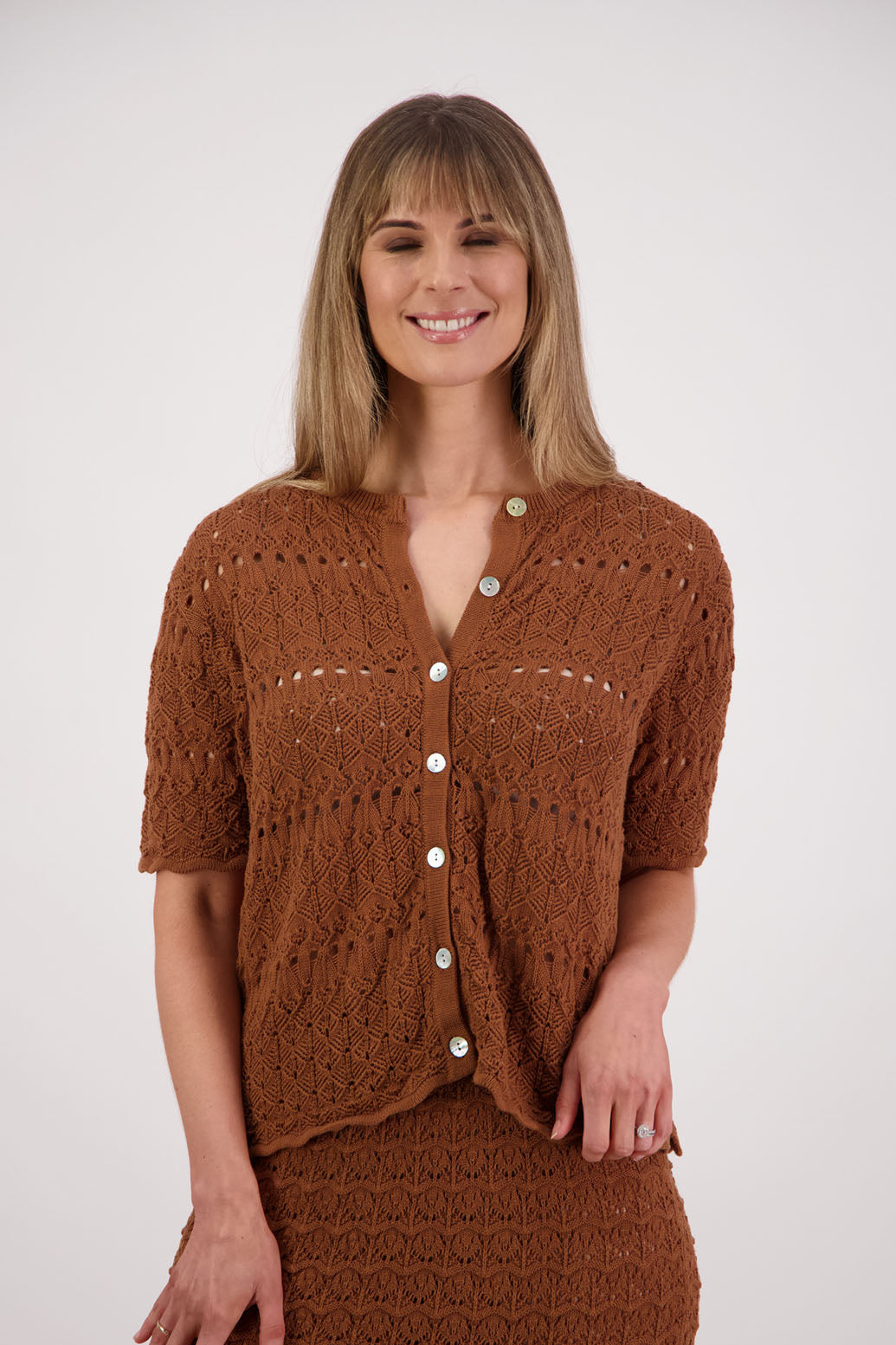 Womens knitted cotton lace short sleeve cardigan with shaped hem and scalloped edging. Briarwood NZ. Posy, Tan