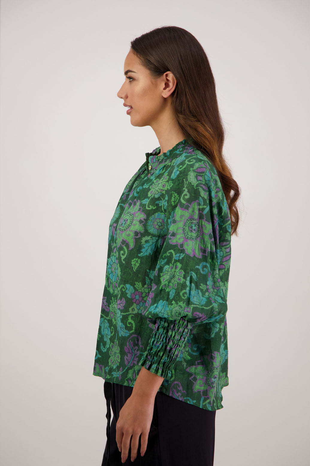 Raewyn Shirt in Green Floral by Briarwood NZ. 100% Ramie shirt with long sleeves, ruffle neckline, shirred waist and button front.