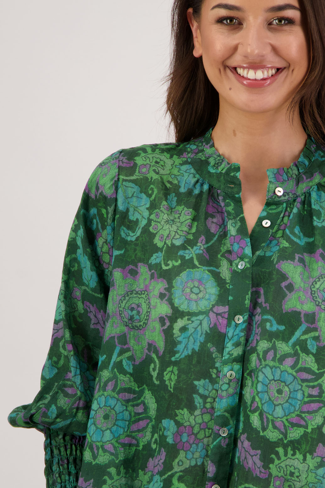 Raewyn Shirt in Green Floral by Briarwood NZ. 100% Ramie shirt with long sleeves, ruffle neckline, shirred waist and button front.