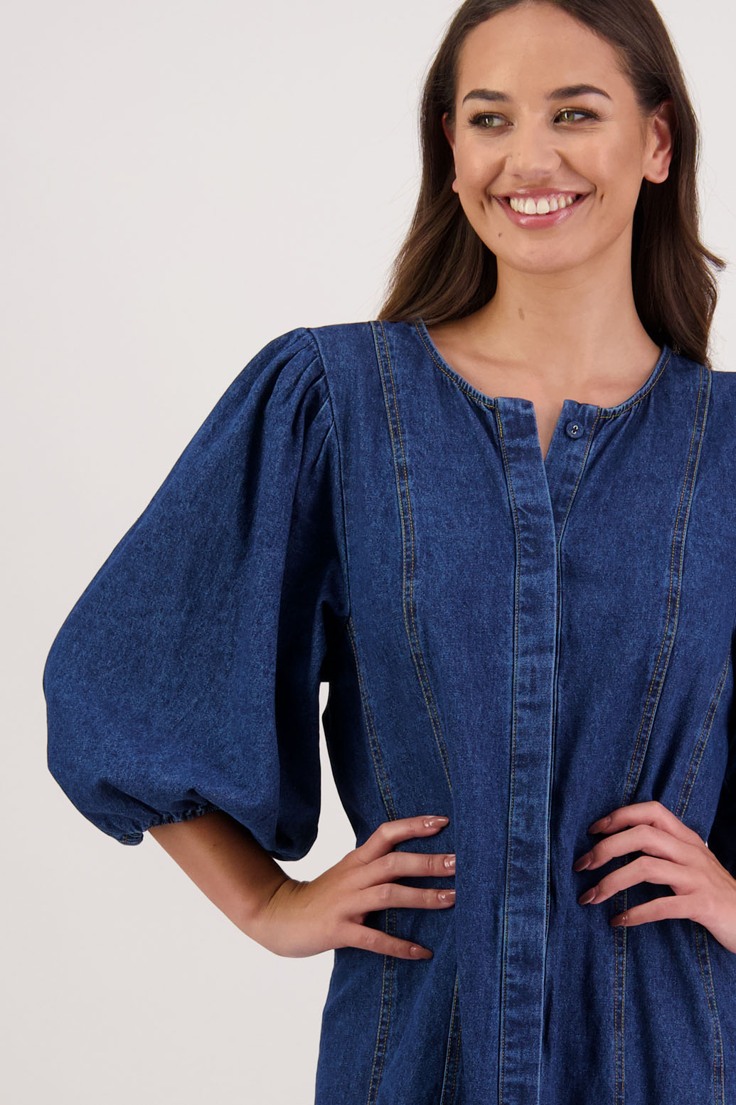 Rafferty Denim Dress by Briarwood NZ. 100% cotton dress, 3/4 sleeves, button through full length with no collar, stitched shaped panels front & back
