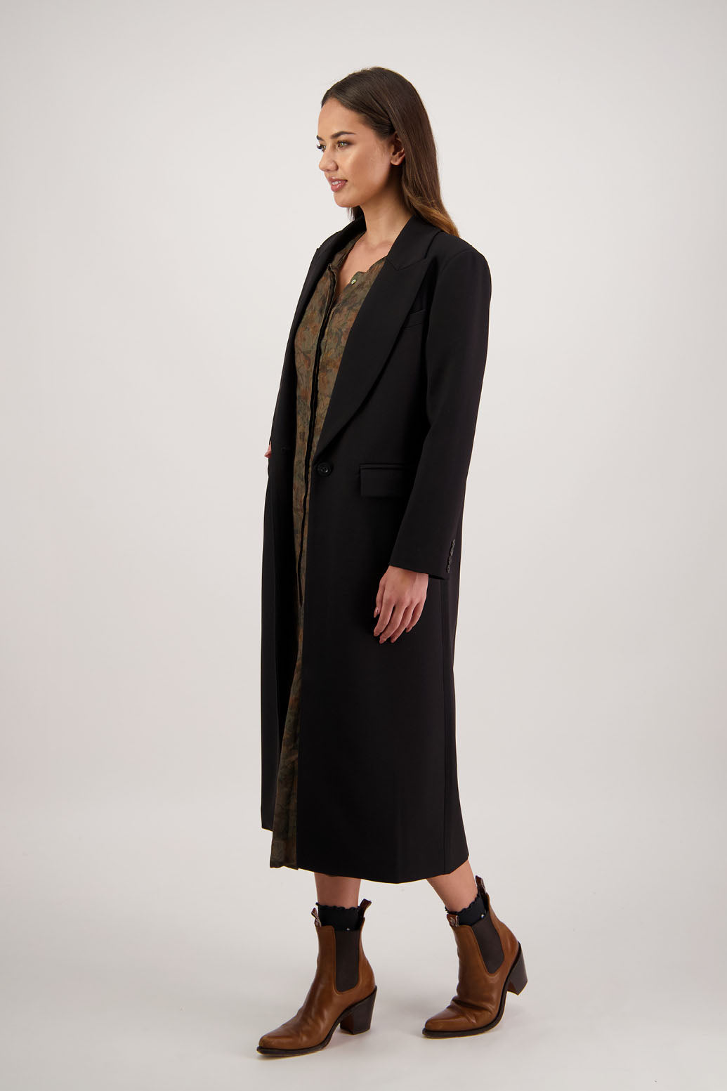 Ramsay Coat in Black by Briarwood NZ. A  blend of rayon, polyester and spandex tuxedo style coat with single button closure, flap pockets and high back split