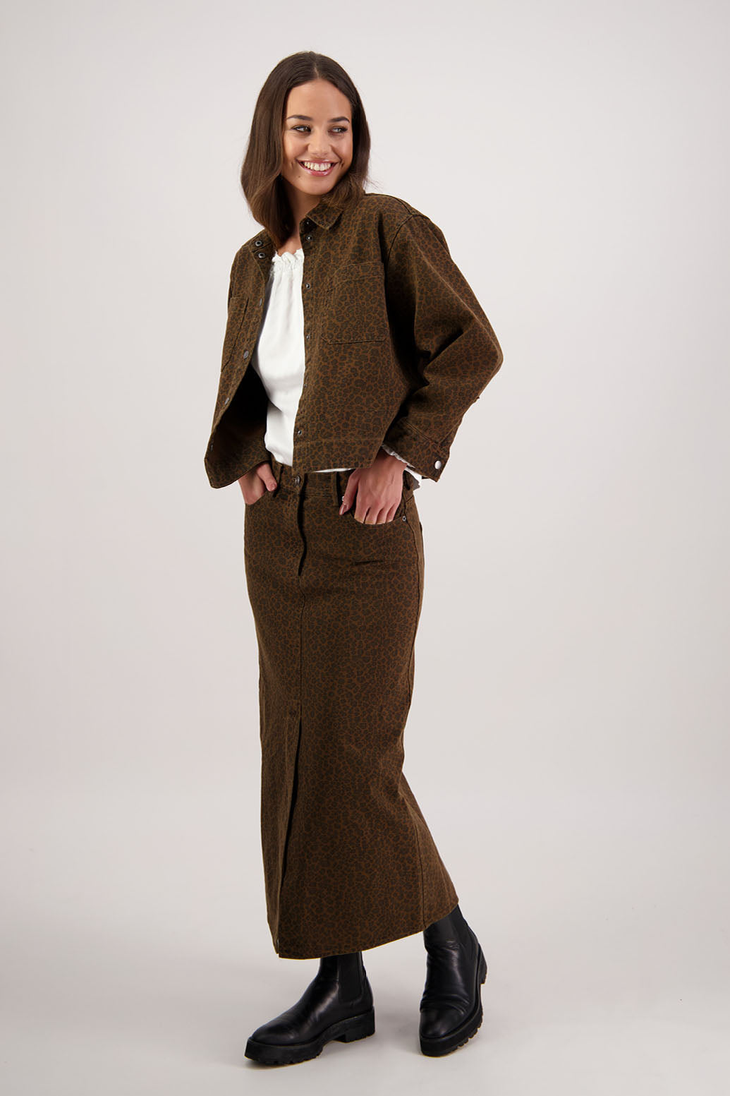 Rebel Denim Skirt in Tan Animal by Briarwood NZ. 100% cotton denim button through skirt, slight A-line, front pockets, stitched down panels