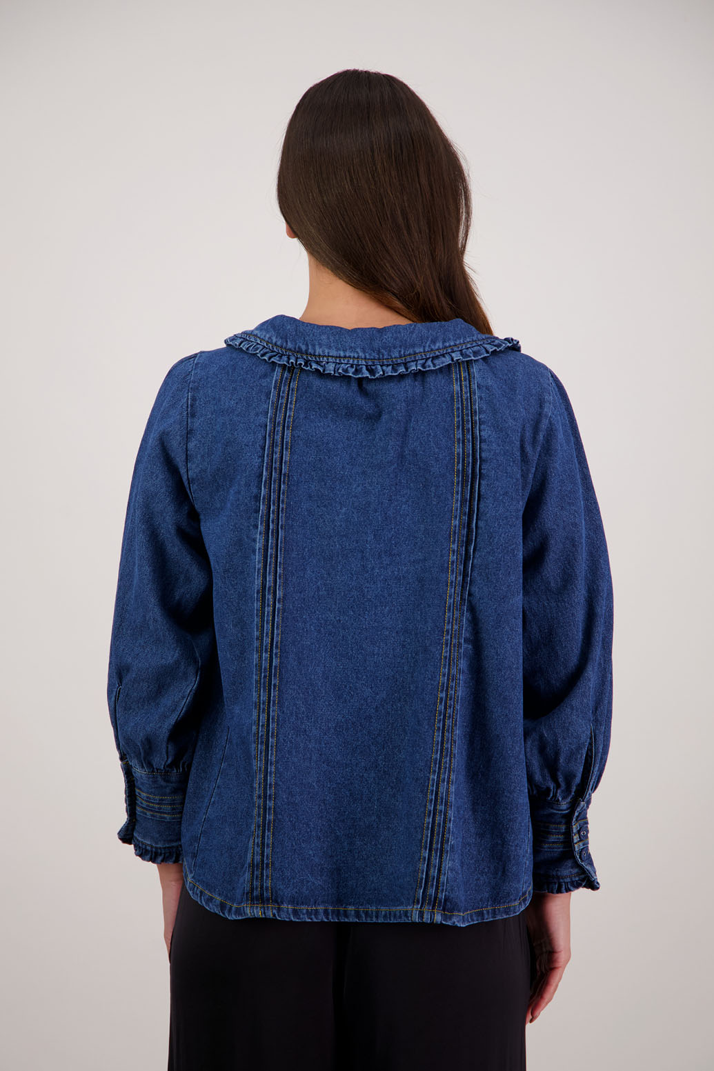 Redmond Denim Top by Briarwood NZ. 100% cotton top with pin tucks, shaped collar with ruffle and tie, full length sleeves with pin tucks on buttoned cuff