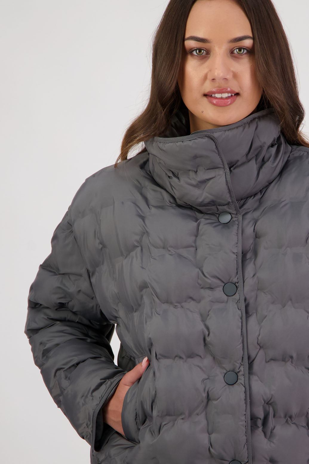 Rhodes Padded Jacket in Charcoal by Briarwood NZ. Features, magnetic dome closures, filled with plush fibres, elastic pull across the back with toggles to hold it in place, high collar with invisible magnetic closure, pockets
