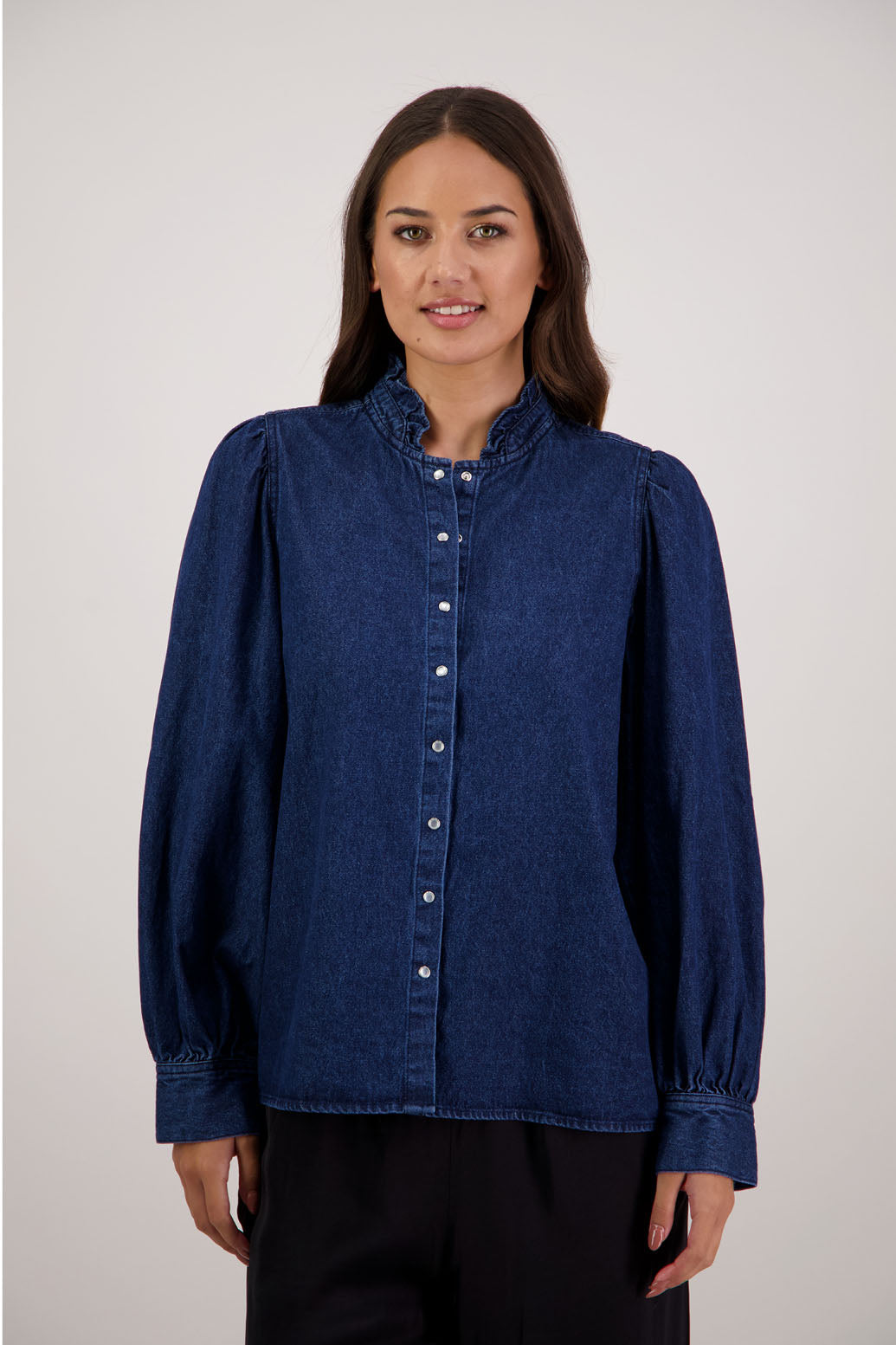 Ricci Denim Shirt by Briarwood NZ. 100% cotton shirt with full length sleeves, snap button closure, ruffles around neck