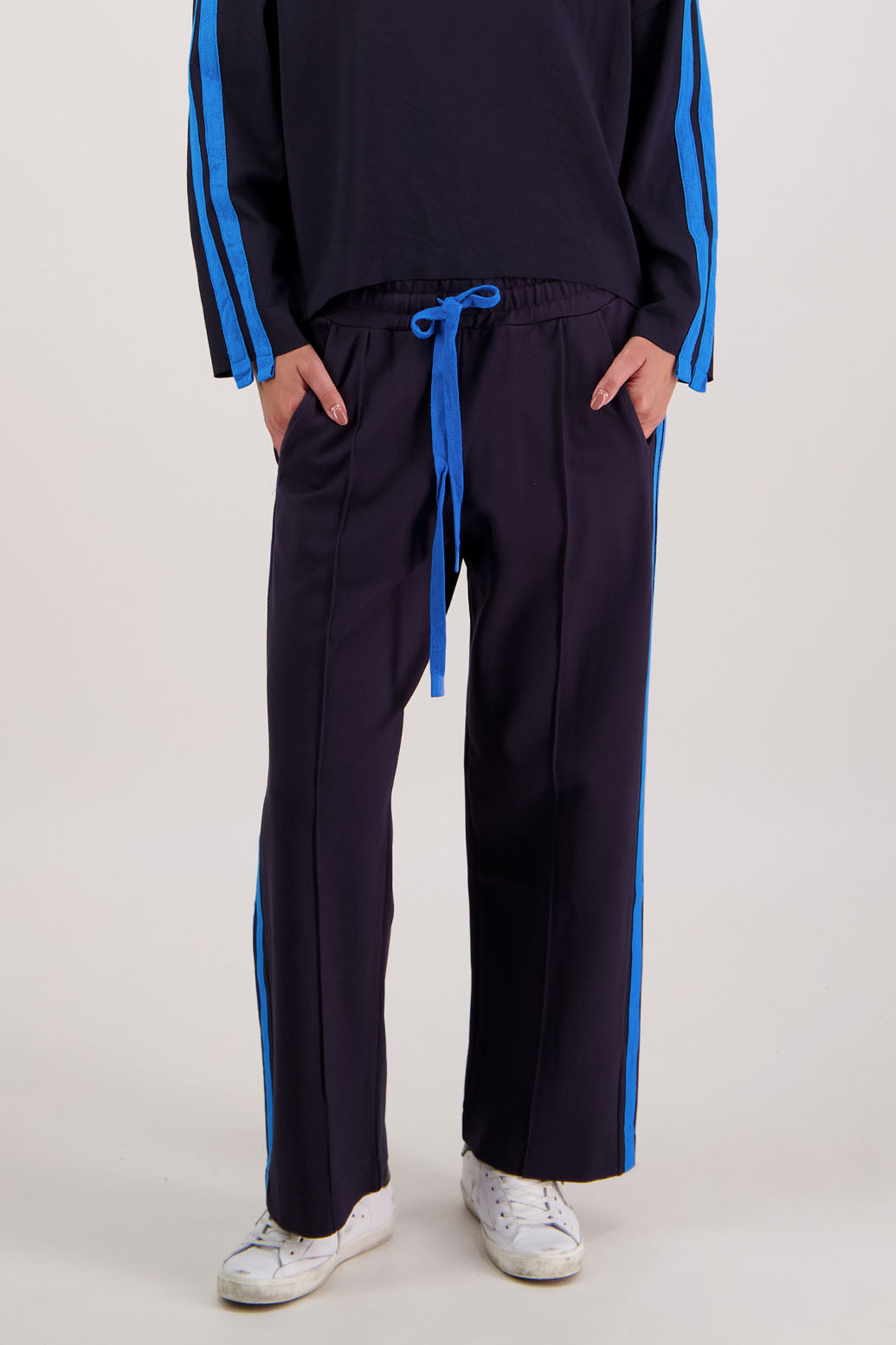 Rick Pant in Ink by Briarwood NZ. 100% Ponte pant with elasticated waist with draw cord, pin tuck front & back, double side stripe and pockets