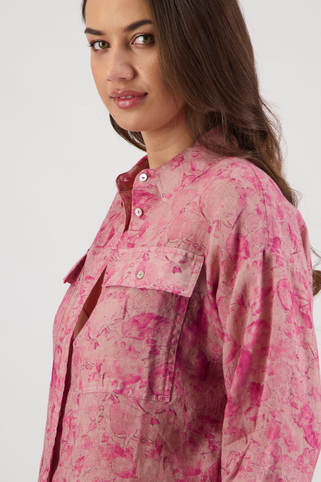 Ripley Shirt in Pink Floral by Briarwood NZ. 100% Ramie collared button through shirt, full length sleeves, longer at the back, side splits, pockets on the front