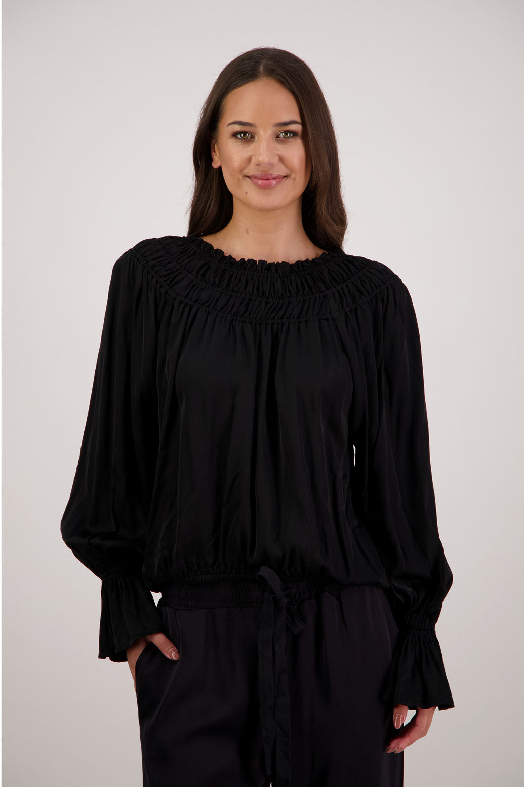 Rosemarie Top in Black by Briarwood NZ. 100% viscose top with 3 panel gathered neck, full length sleeves with ruffle, elasticated waistband