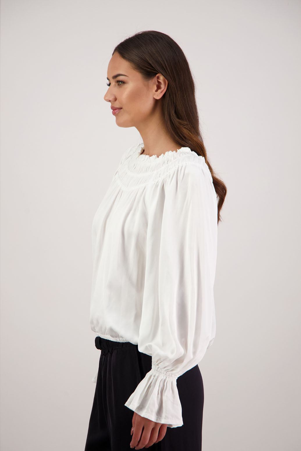 Rosemarie Top in Ivory by Briarwood NZ. 100% viscose top with 3 panel gathered neck, full length sleeves with ruffle, elasticated waistband