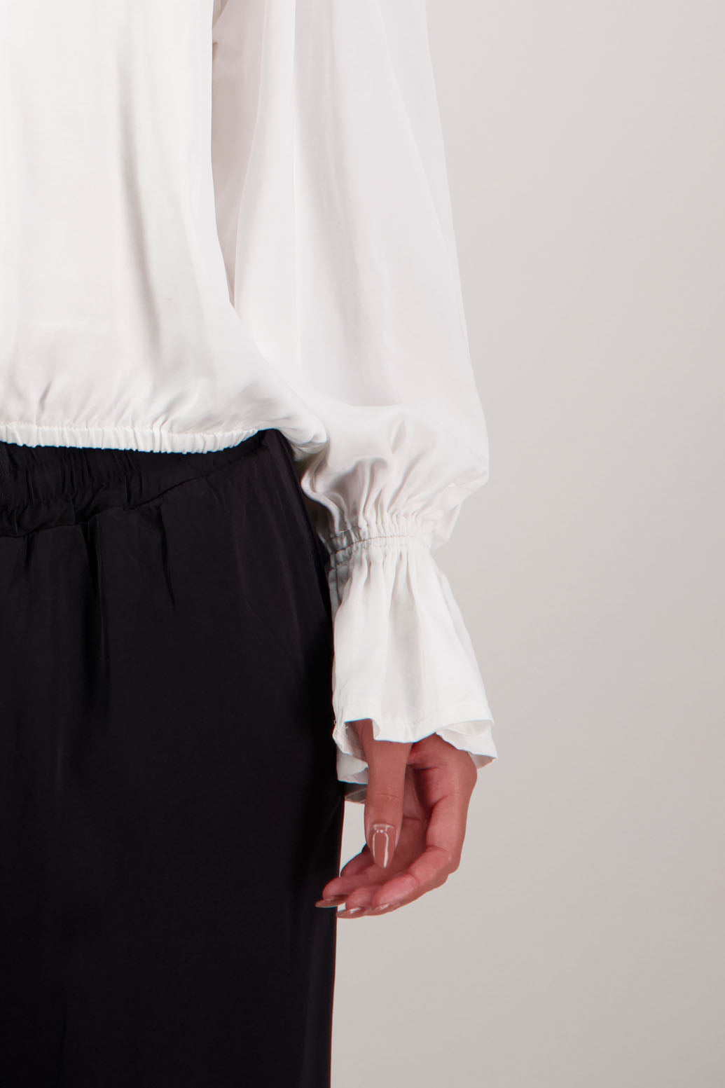 Rosemarie Top in Ivory by Briarwood NZ. 100% viscose top with 3 panel gathered neck, full length sleeves with ruffle, elasticated waistband