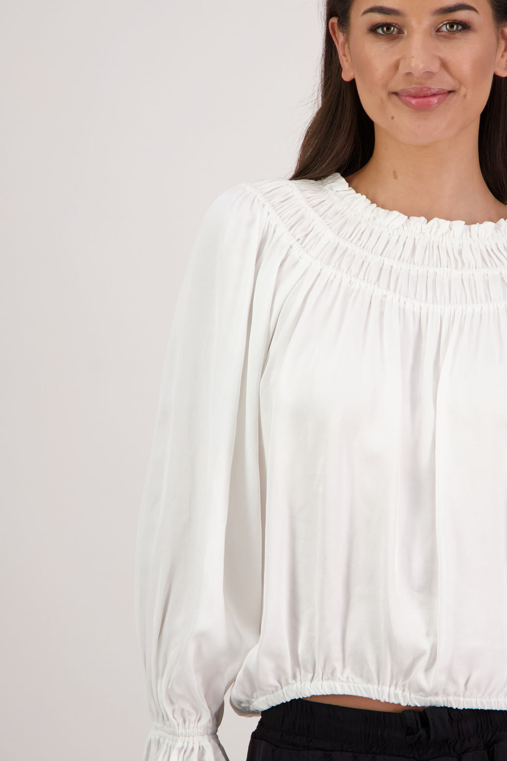 Rosemarie Top in Ivory by Briarwood NZ. 100% viscose top with 3 panel gathered neck, full length sleeves with ruffle, elasticated waistband