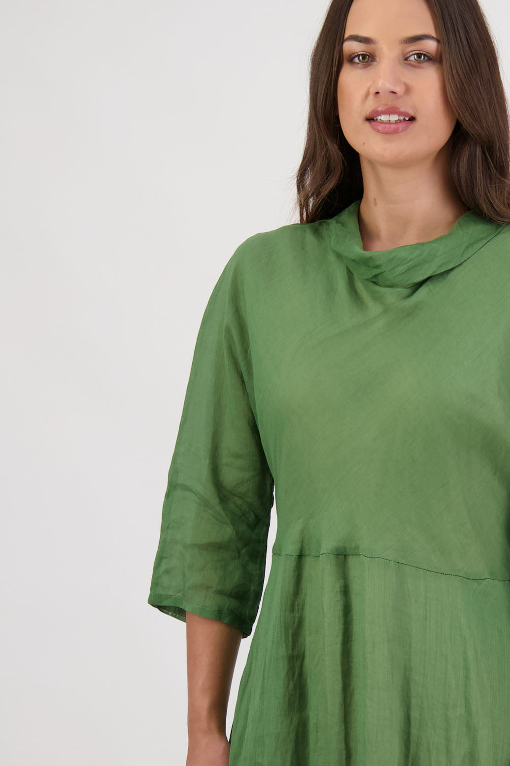Rowena Dress in Grass by Briarwood NZ. 100% Ramie dress, roll neck, bias cut top, puff hem start, 3/4 sleeves, pockets, lined