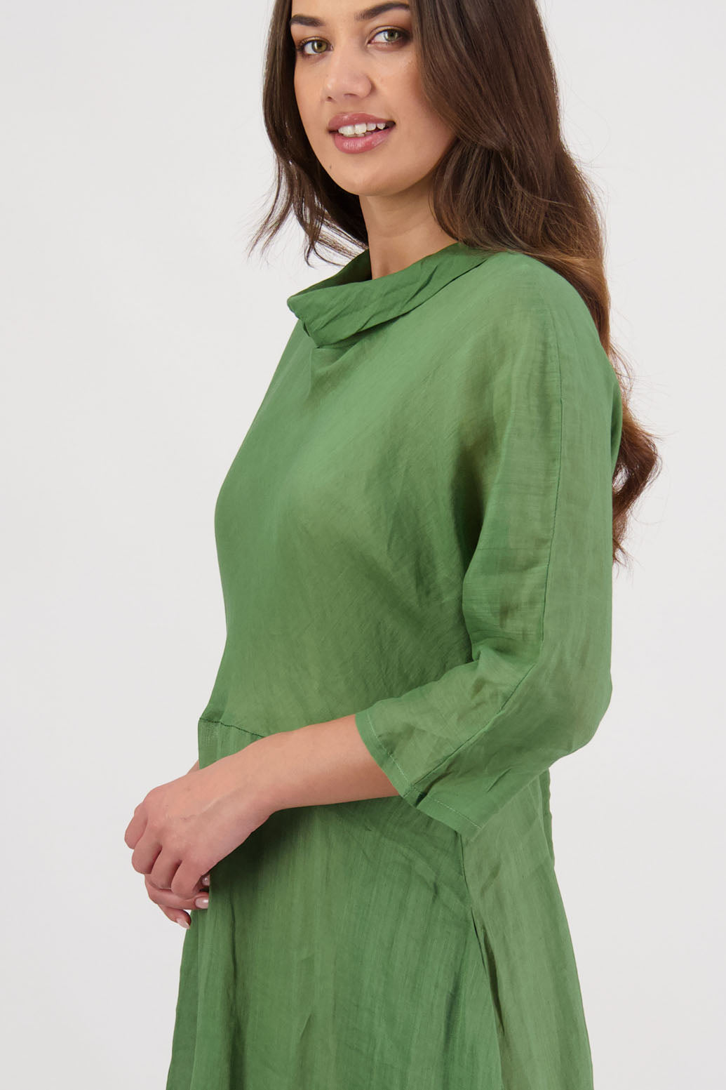 Rowena Dress in Grass by Briarwood NZ. 100% Ramie dress, roll neck, bias cut top, puff hem start, 3/4 sleeves, pockets, lined