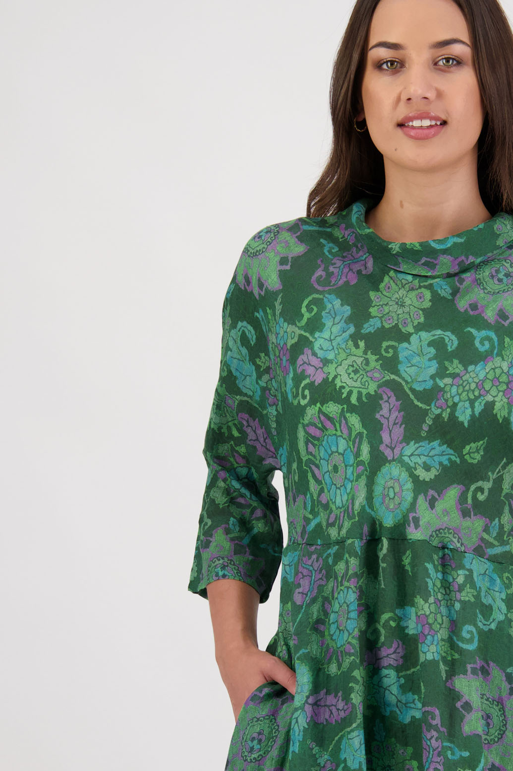 Rowena Dress in Green Floral by Briarwood NZ. 100% Ramie dress, roll neck, bias cut top, puff hem start, 3/4 sleeves, pockets, lined
