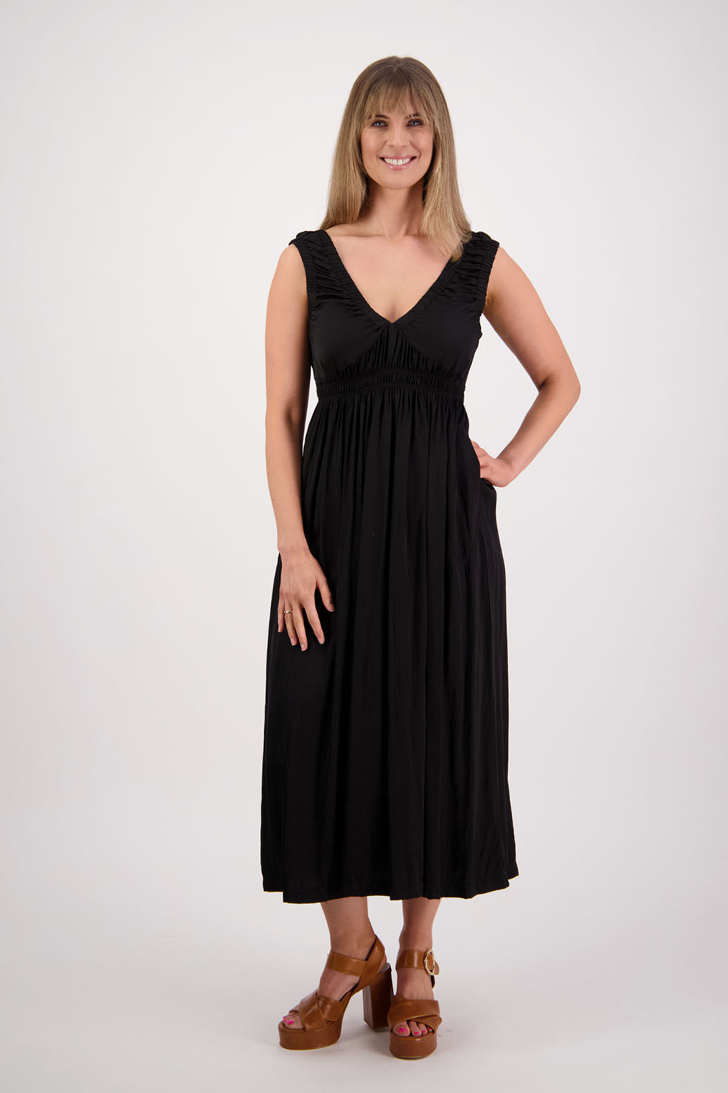 Womens long viscose black dress. Sleeveless with v neck and gathered shoulders and the bust. Elastic waist and pockets. Briarwood NZ. Sapphire.