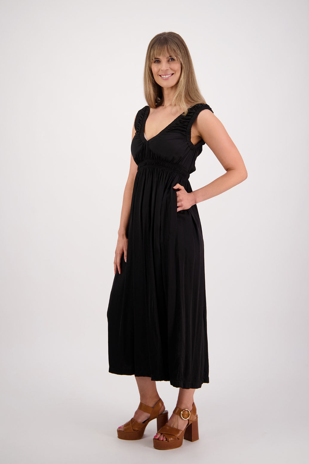 Womens long viscose black dress. Sleeveless with v neck and gathered shoulders and the bust. Elastic waist and pockets. Briarwood NZ. Sapphire.