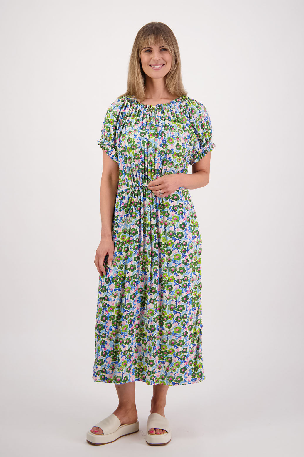 Womens long daisy print dress with slightly gathered centre panel, Ruffle around the neck and sleeves and pockets. Viscose. Briarwood NZ. Sasha