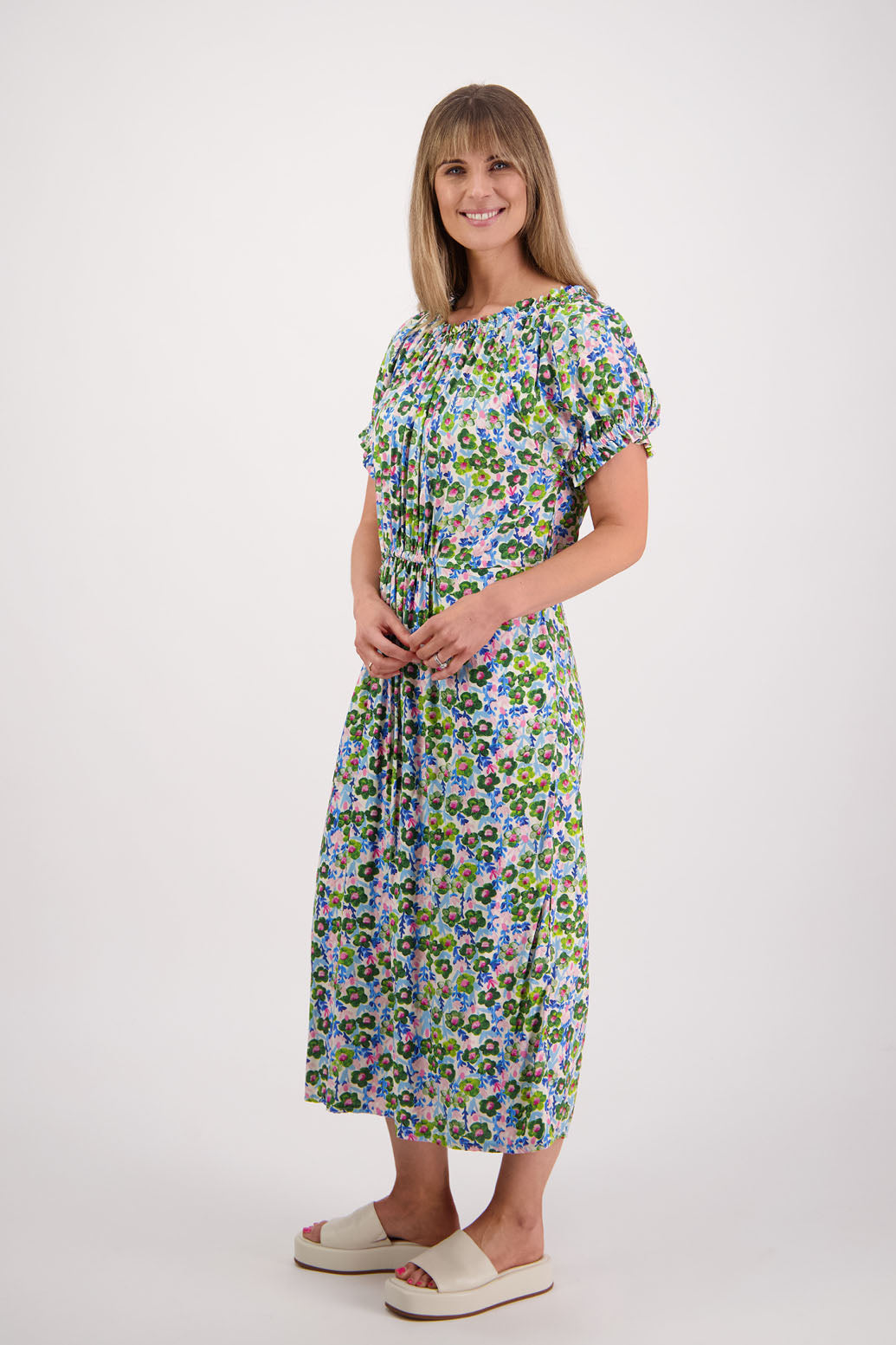 Womens long daisy print dress with slightly gathered centre panel, Ruffle around the neck and sleeves and pockets. Viscose. Briarwood NZ. Sasha