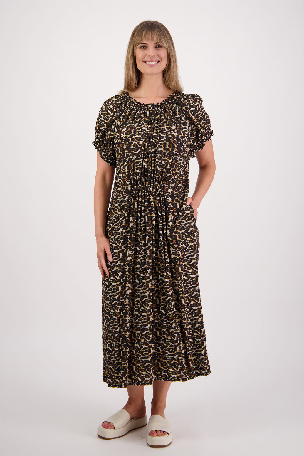 Womens long leopard print dress with slightly gathered centre panel, Ruffle around the neck and sleeves and pockets. Viscose. Briarwood NZ. Sasha