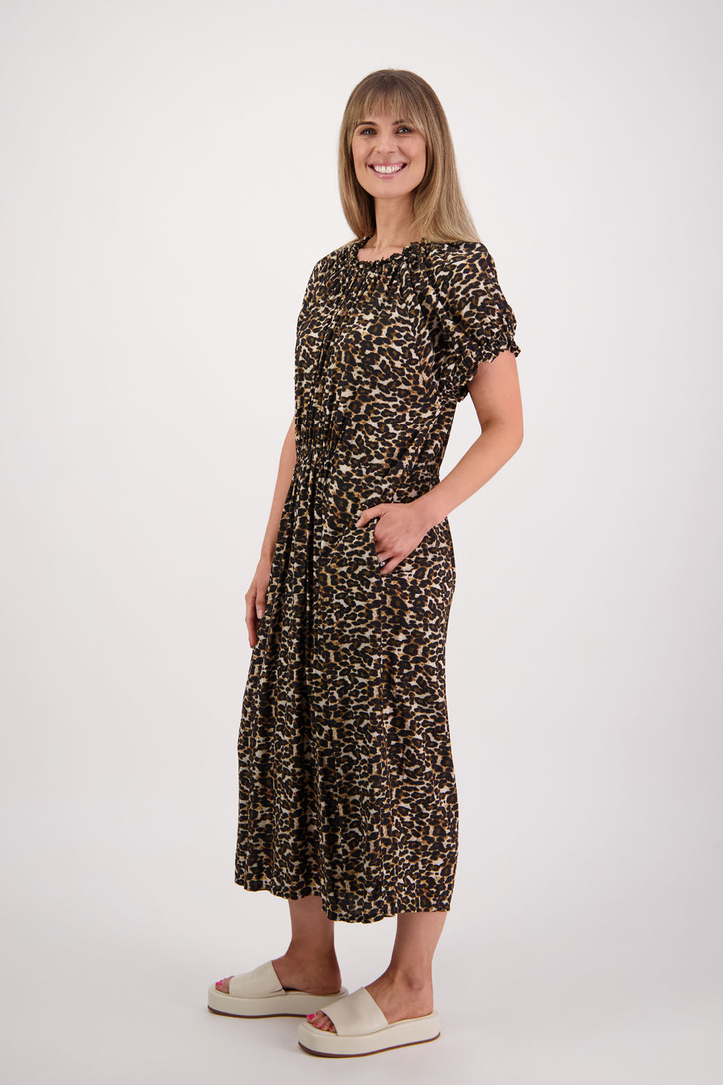 Womens long leopard print dress with slightly gathered centre panel, Ruffle around the neck and sleeves and pockets. Viscose. Briarwood NZ. Sasha