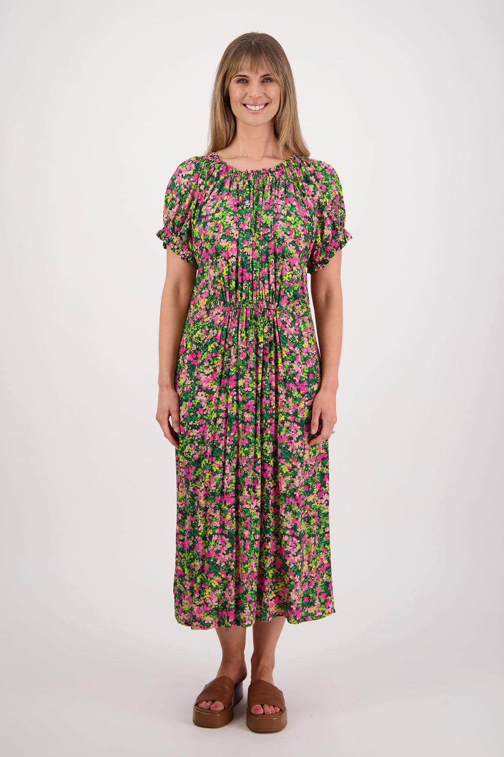Womens long pansy print dress with slightly gathered centre panel, Ruffle around the neck and sleeves and pockets. Viscose. Briarwood NZ. Sasha