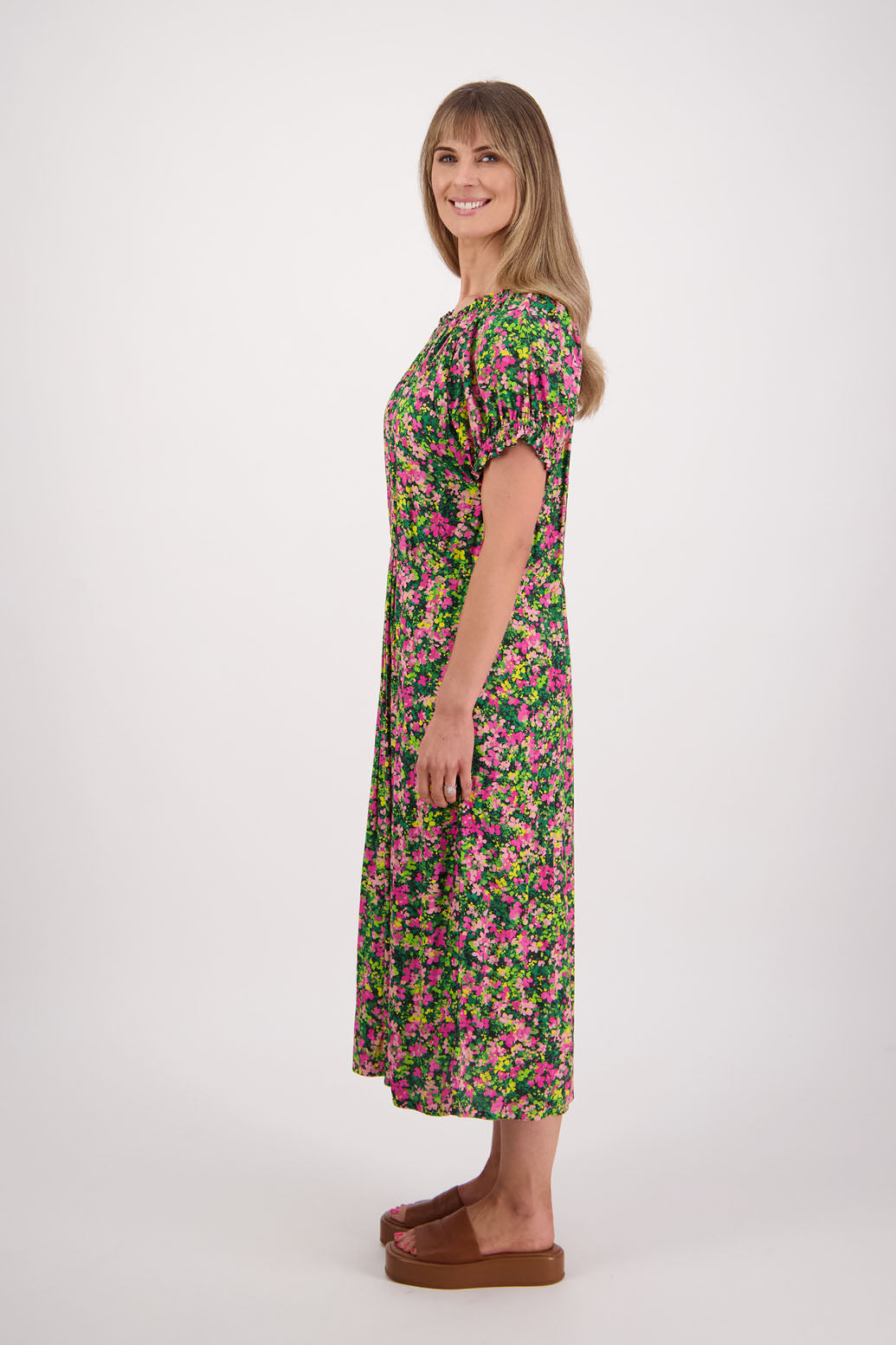 Womens long pansy print dress with slightly gathered centre panel, Ruffle around the neck and sleeves and pockets. Viscose. Briarwood NZ. Sasha