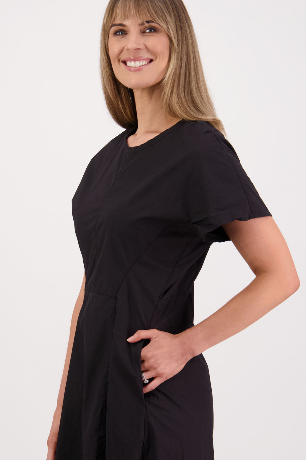 Womens shaped and waisted black dress with A-Line skirt, cap sleeves and zip up the back. Briarwood NZ. Cotton Poplin. Saunders