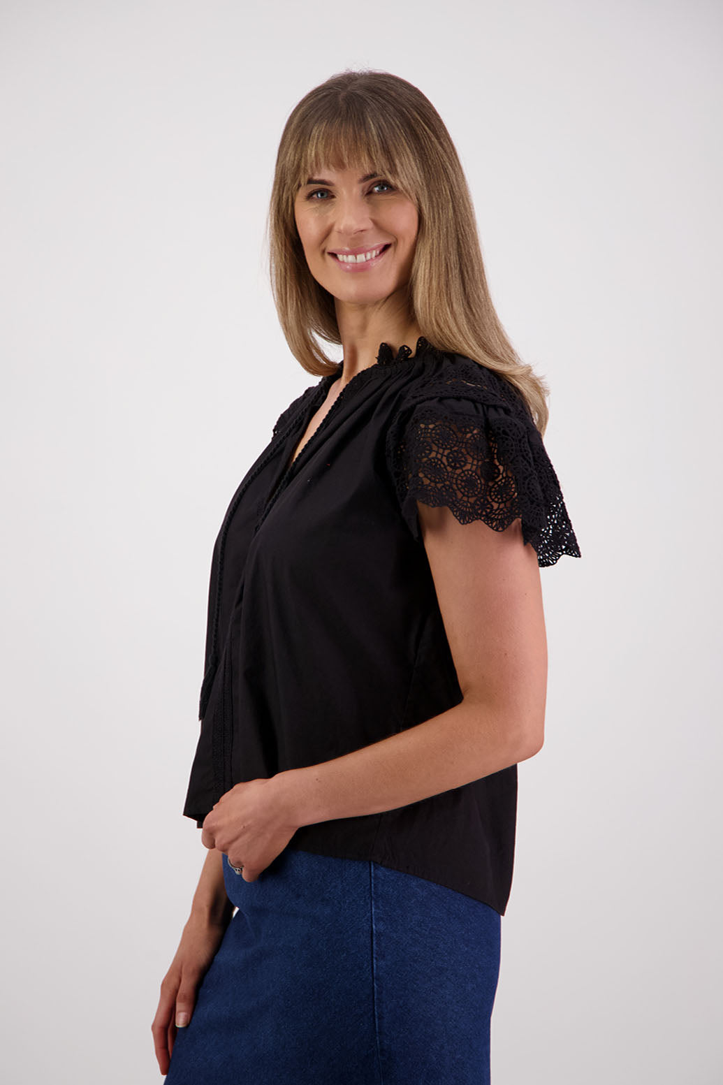 Womens short sleeve black top with lace trim sleeves and lace trim down the front. Briarwood NZ. Cotton Poplin / Lace. Sebbie