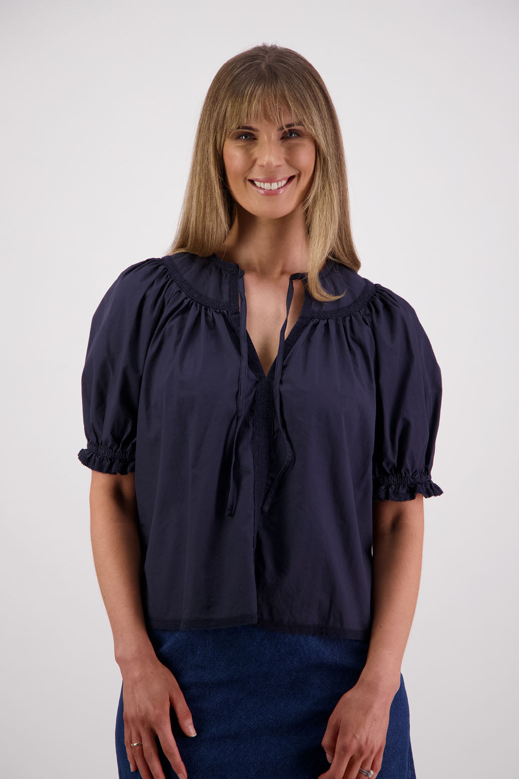 Womens Ink short sleeve top with soft gathering onto yolk with lace trim around the sleeves, hem + yolk. Briarwood NZ. Cotton Poplin / Lace. Selma