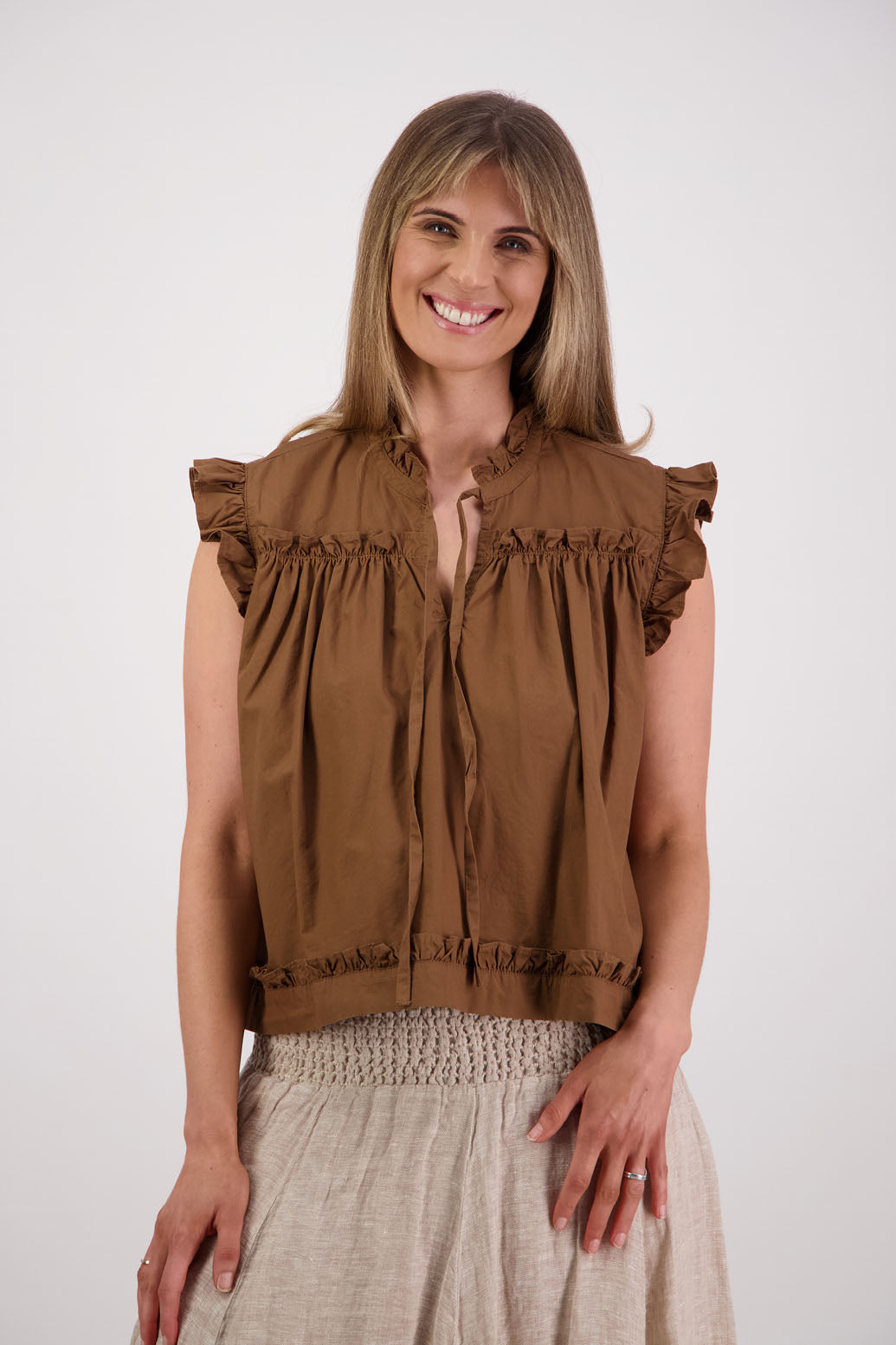 Womens Tan short sleeve wide top with V neck + tie, and small ruffle on the yolk, hem and sleeves. Briarwood NZ. Cotton Poplin. Skye