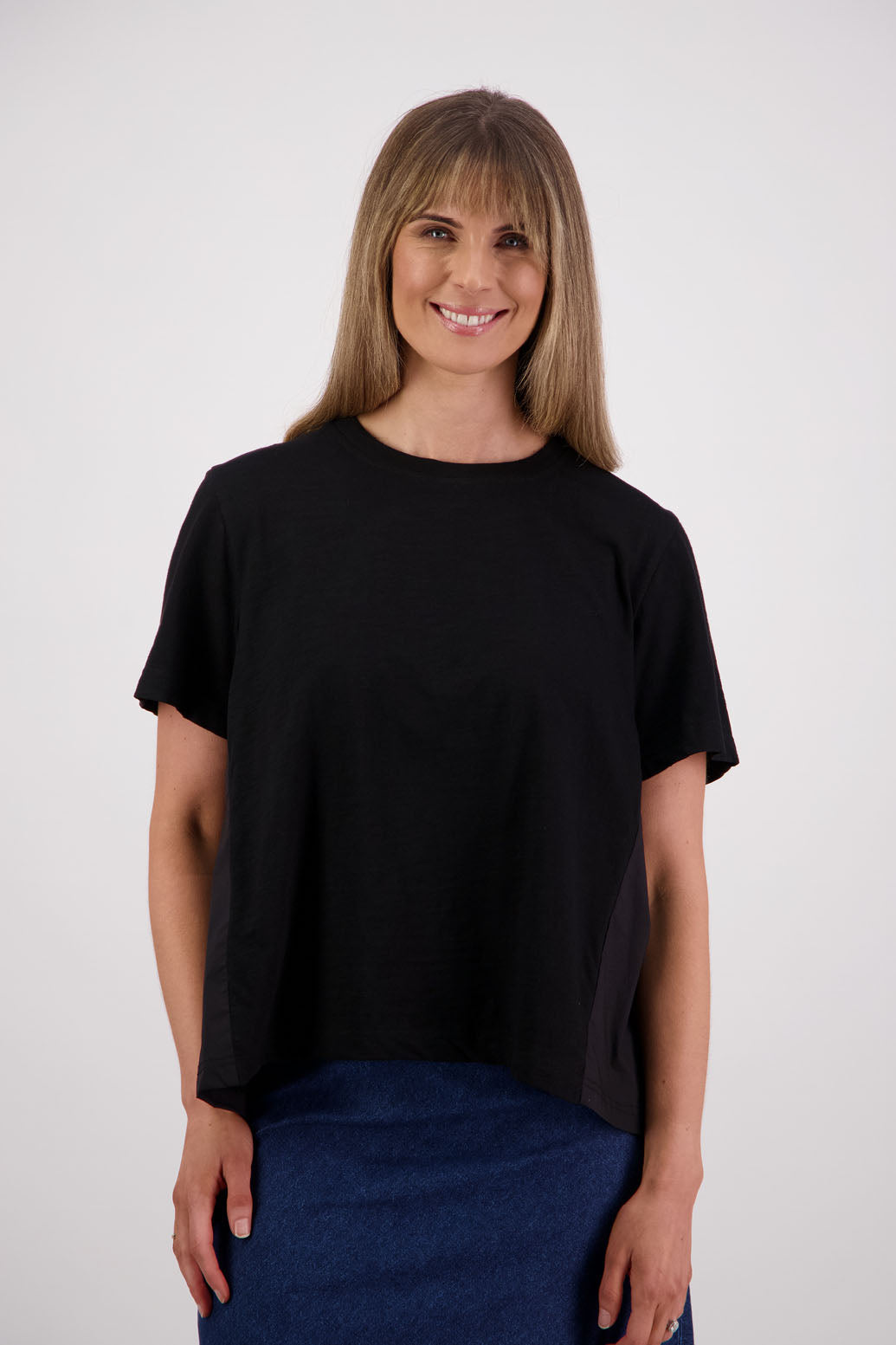 Womens oversized black cotton t-shirt with scooped neckline and swing back with cotton poplin pleat. Briarwood NZ. Smiley, Black
