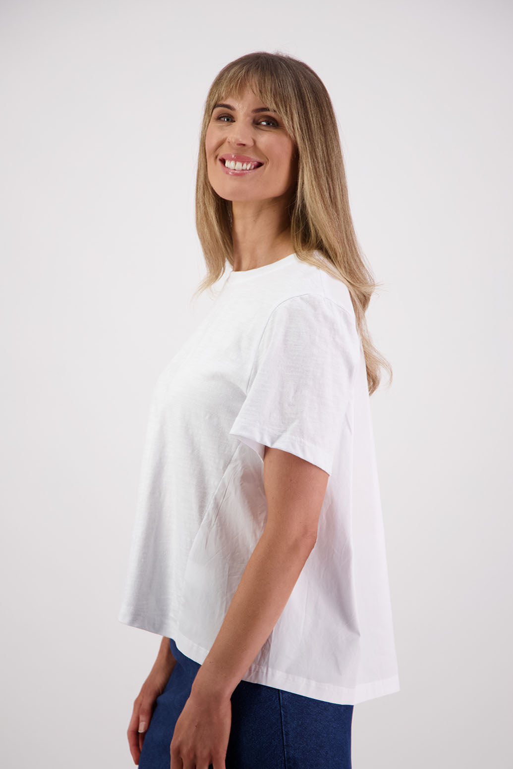 Womens oversized black cotton t-shirt with scooped neckline and swing back with cotton poplin pleat. Briarwood NZ. Smiley, White