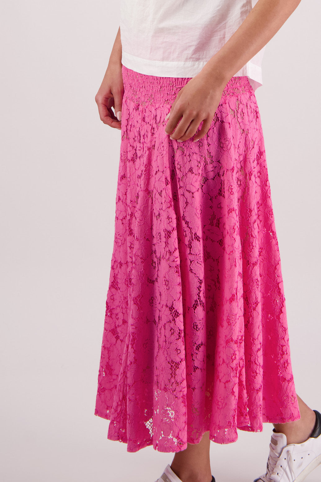 Closeup side view of Briarwood Sparkle skirt in pink lace.